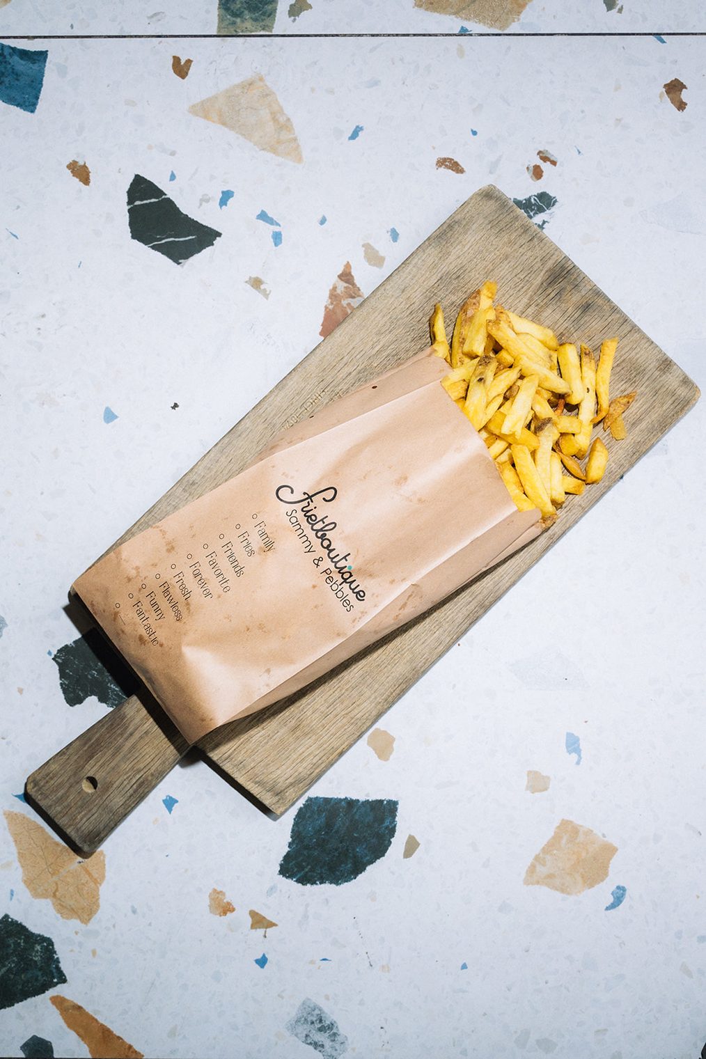 Verse friet in een papieren zak van Frietboutique